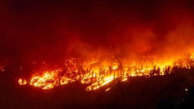 Wildfires threaten western Canada city as far north evacuated
