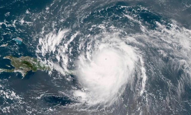 Hurricane Erin intensifies offshore, lashes Caribbean with rain